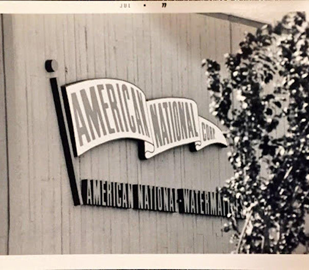American National logo on a wooden background with a tree