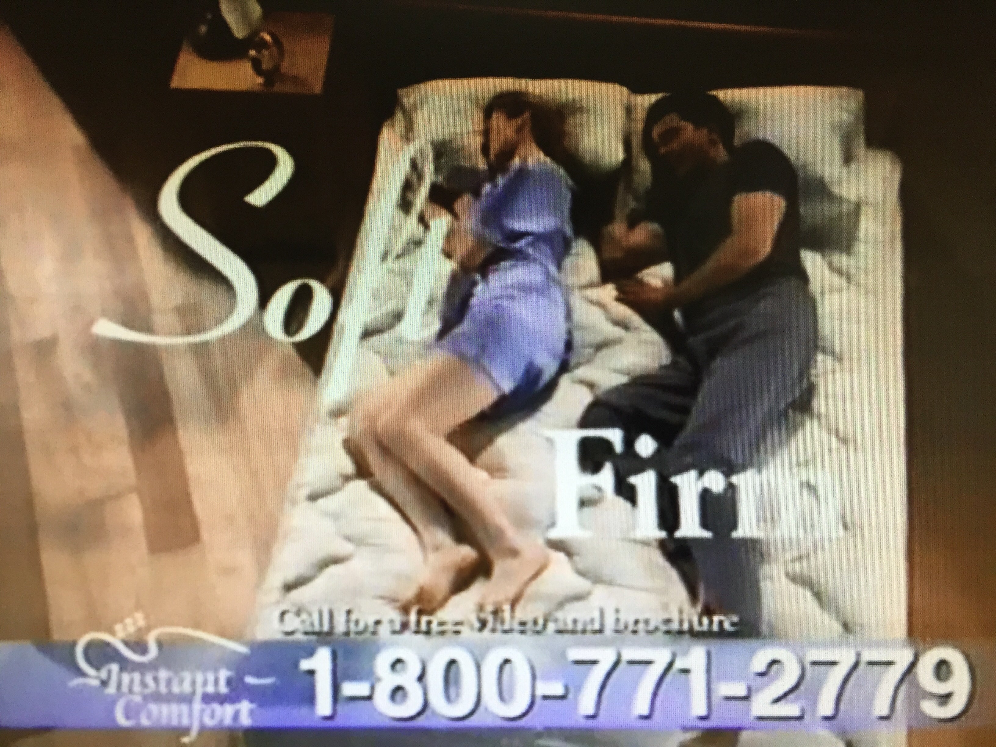 Advertisement for a mattress with a couple on it, featuring the text 'Soft Firm' and contact information.