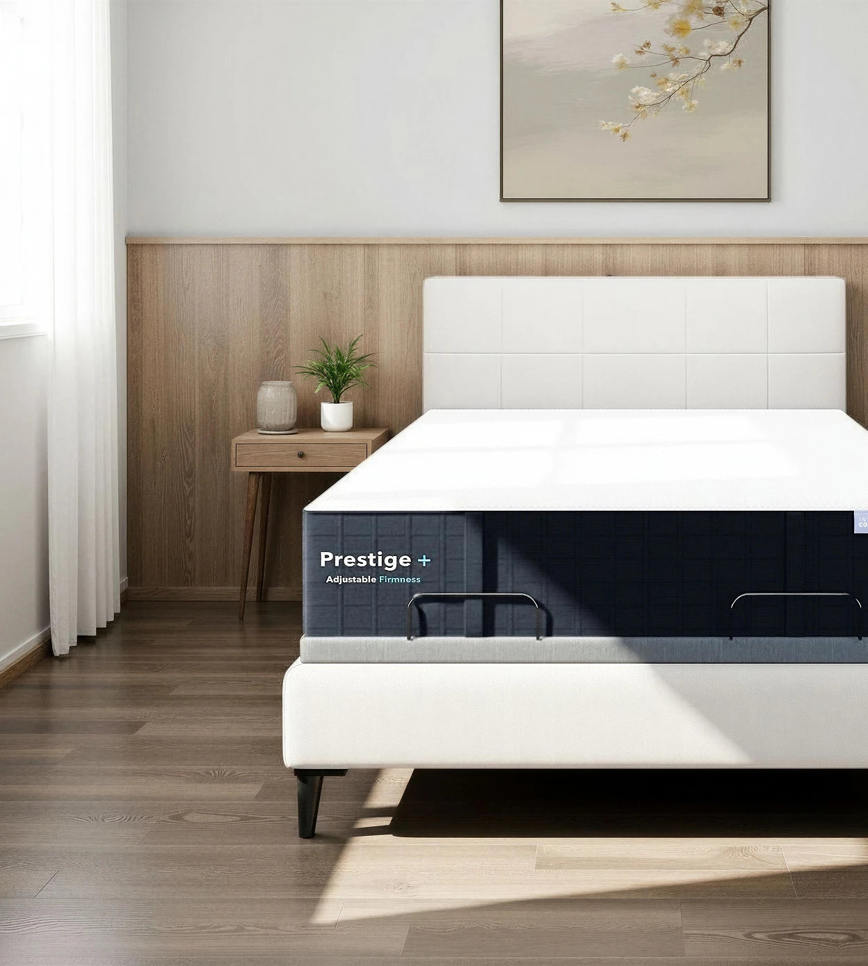 White bed with 'Prestige' adjustable frame in a bedroom setting