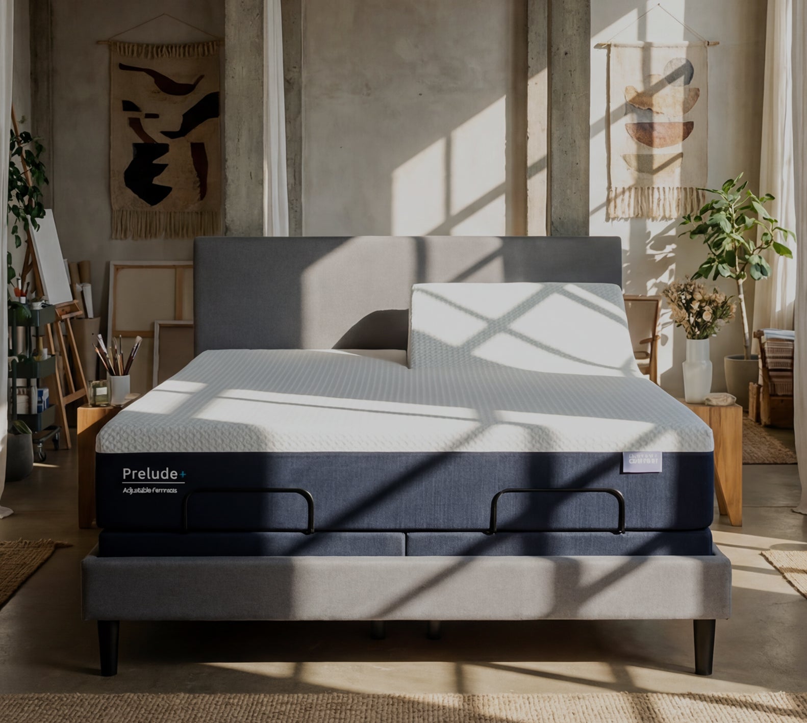 Bed with 'Prelude' mattress in a room with plants and decor