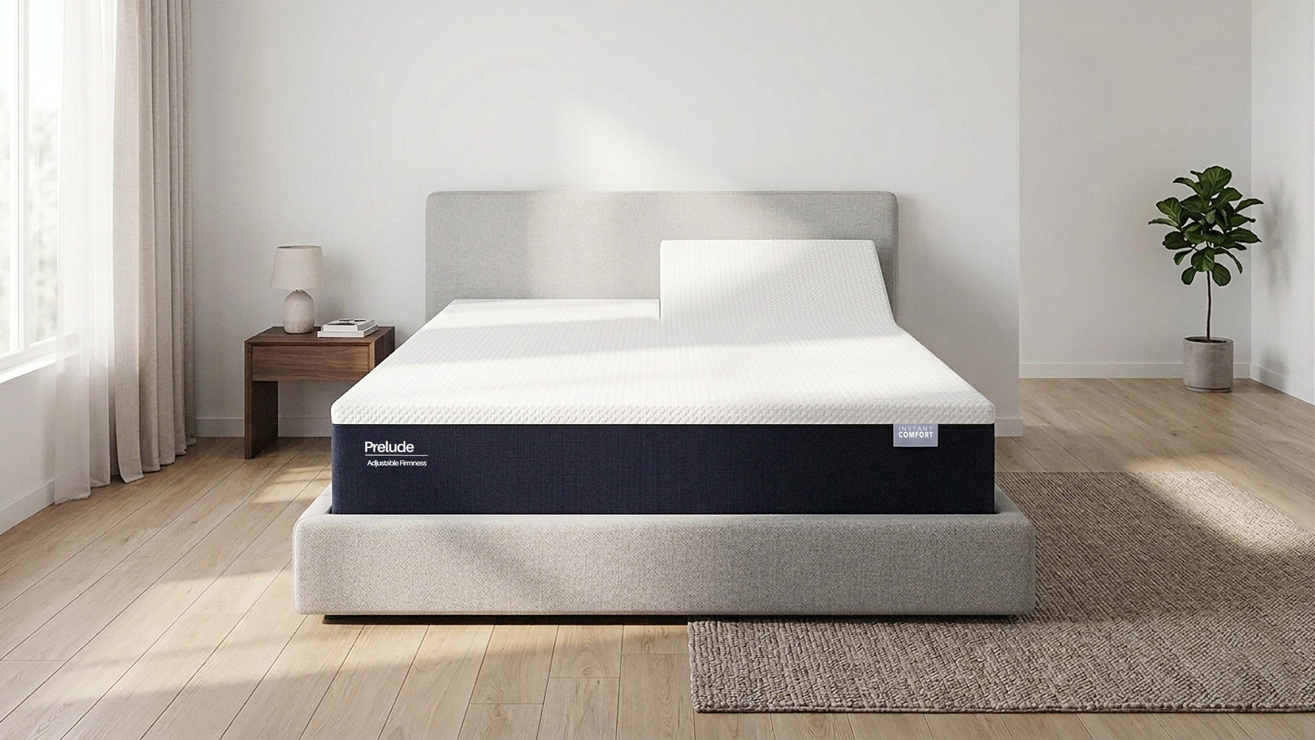 ProLate mattress in a bedroom setting with a side table and plant.