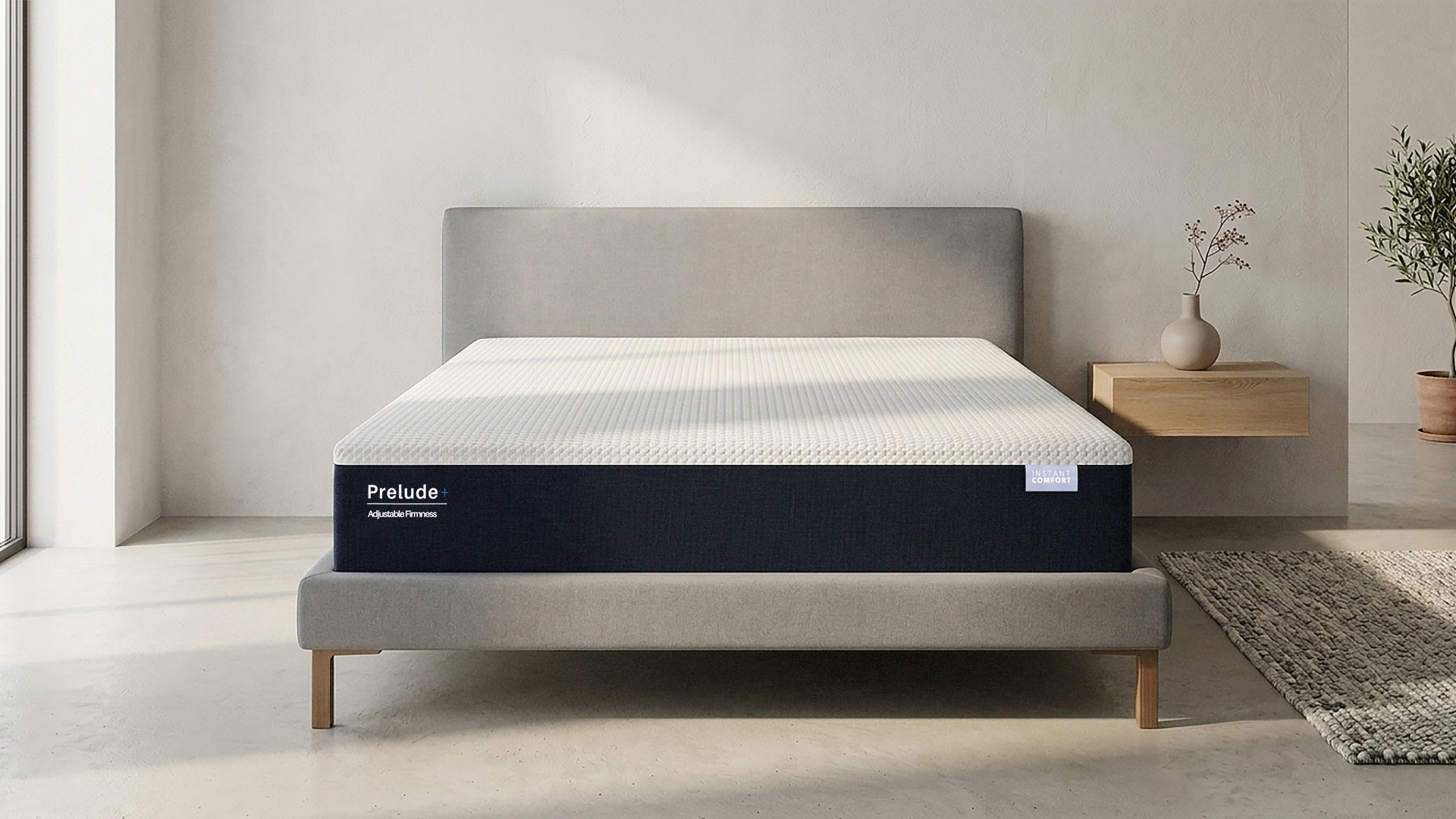 Mattress with 'Prelude' branding in a minimalistic room setting