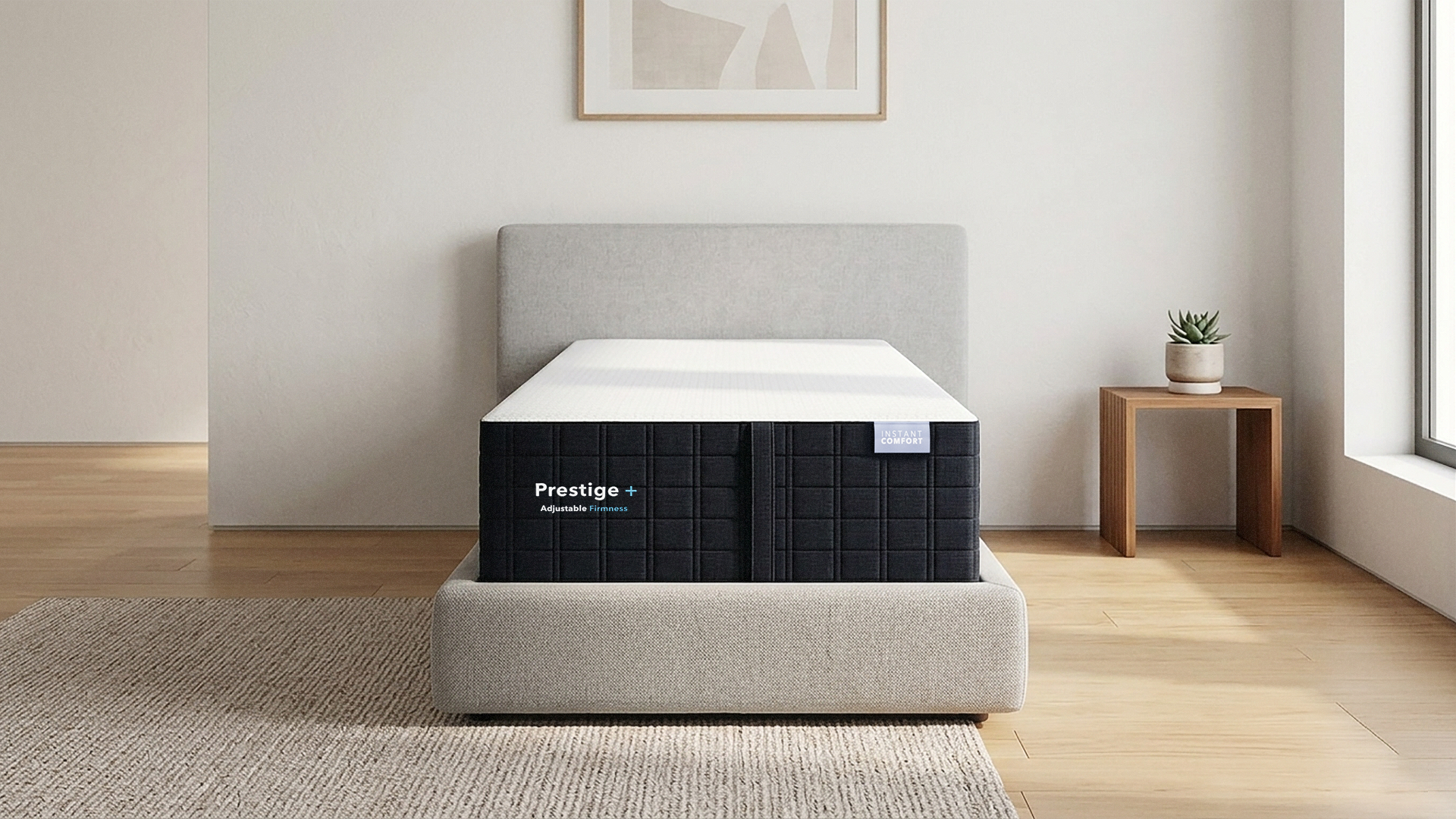 Prestige mattress in a room with a wooden floor and a small table with a plant.